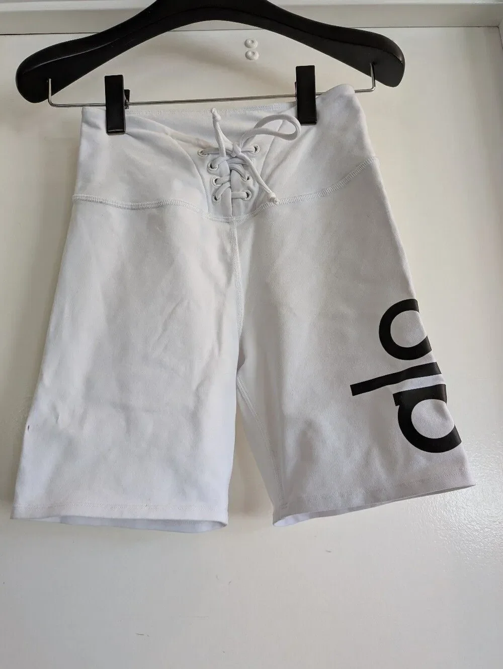 ALO Yoga Lace-Up High-Waist Bike Shorts in White with Black Logo